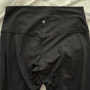 Lululemon Black embossed leggings. Size 12. Like new.